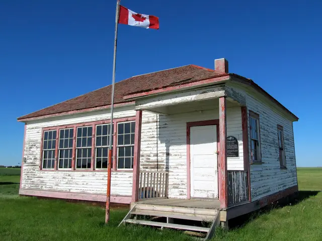 St. John's one-room school building with Canadian flag